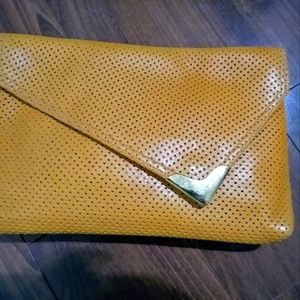 Perforated yellow clutch